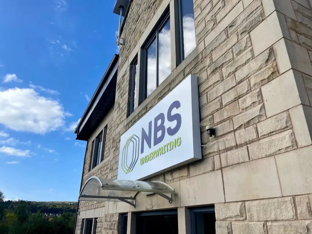 Custom back-lit illuminated office signage designed and installed for the NBS corporate headquarters in Bingley, Bradford.