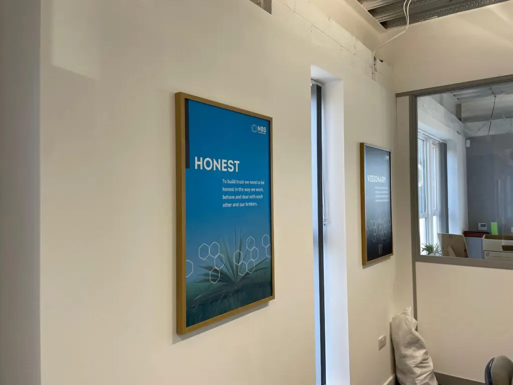 Complete design and installation of bespoke commercial interior branding graphics and signage in a Bradford corporate headquarters.