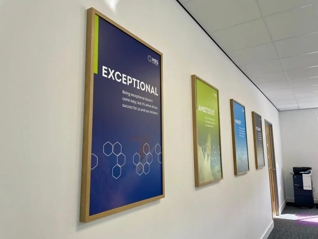 Custom framed prints designed and installed for NBS as part of a commercial office interior branding project in Bradford, West Yorkshire.